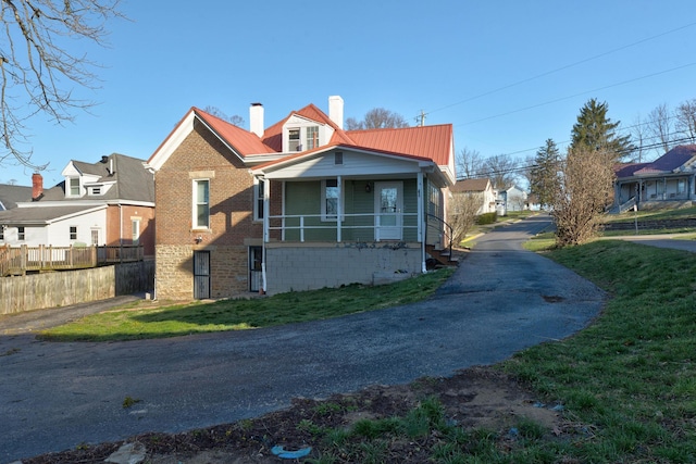 236 W High St, Mt Sterling, KY 40353 - view of front of home featuring a porch, a metal roof, and a chimney