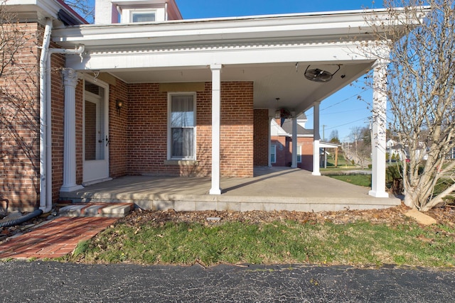 236 W High St, Mt Sterling, KY 40353 - entrance to property with covered porch and brick siding