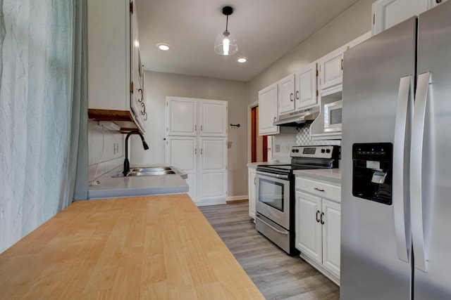 236 W High St, Mt Sterling, KY 40353 - kitchen with stainless steel appliances, under cabinet range hood, white cabinets, light wood-type flooring, and wood counters