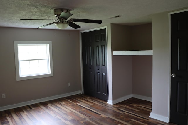 2721 E Ringgold, Somerset, KY 42503 - unfurnished bedroom with a closet, dark wood-style flooring, a textured ceiling, and ceiling fan