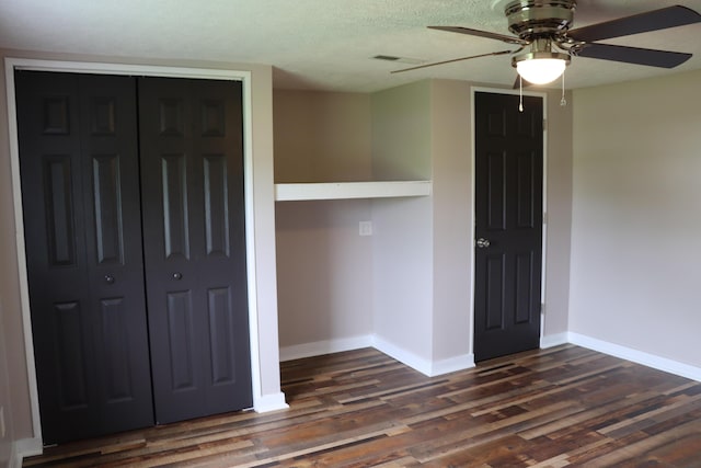 2721 E Ringgold, Somerset, KY 42503 - unfurnished bedroom with dark wood-type flooring, a closet, and ceiling fan