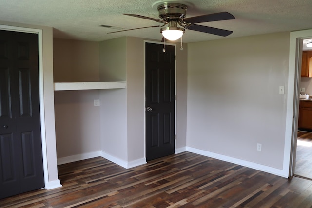 2721 E Ringgold, Somerset, KY 42503 - unfurnished bedroom with dark wood finished floors, a textured ceiling, and a ceiling fan