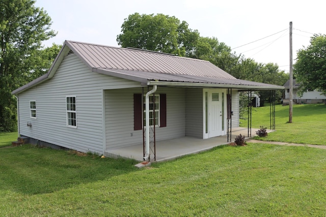 2721 E Ringgold, Somerset, KY 42503 - view of front of property with a front yard, a metal roof, and covered porch
