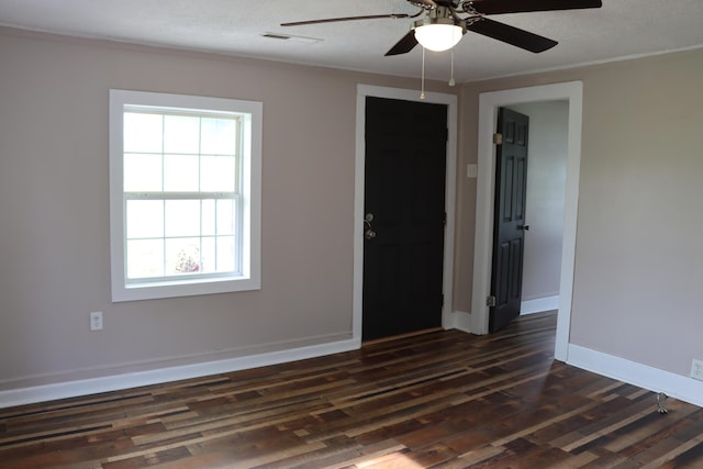 2721 E Ringgold, Somerset, KY 42503 - empty room featuring healthy amount of natural light, dark wood-style flooring, and a ceiling fan