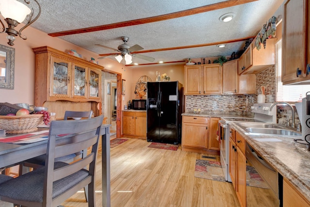 69 Side Run Rd, Wellington, KY 40387 - kitchen with black appliances, a textured ceiling, light wood-style floors, a ceiling fan, and light countertops