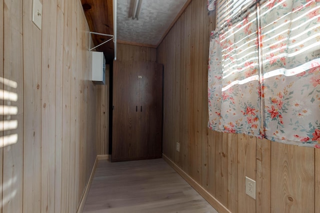 69 Side Run Rd, Wellington, KY 40387 - hallway featuring wooden walls and light wood-style floors