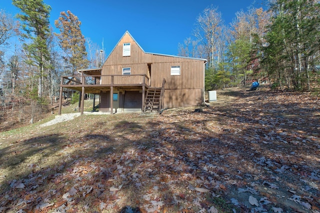 69 Side Run Rd, Wellington, KY 40387 - back of property with a wooden deck and stairway