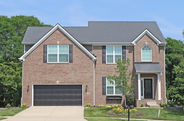 101 Corolla Cir, Georgetown, KY 40324 - view of front of property featuring a garage, concrete driveway, and brick siding
