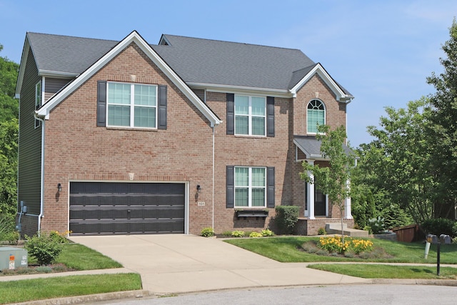101 Corolla Cir, Georgetown, KY 40324 - view of front of property featuring an attached garage, driveway, and brick siding