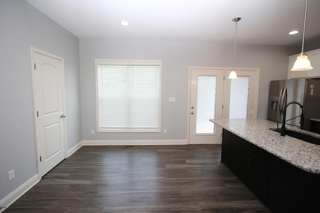 101 Corolla Cir, Georgetown, KY 40324 - kitchen featuring stainless steel fridge, plenty of natural light, light stone countertops, dark wood-type flooring, and recessed lighting