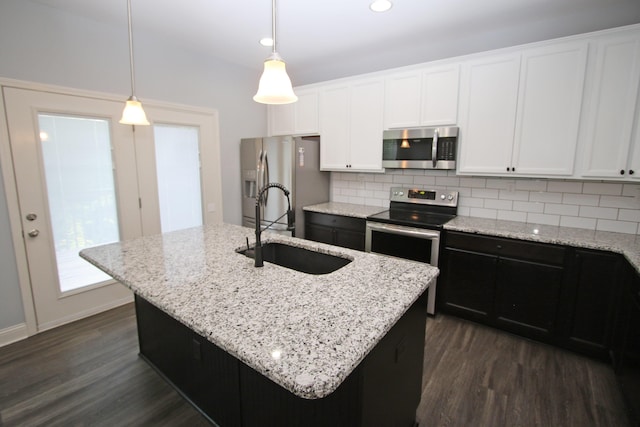 101 Corolla Cir, Georgetown, KY 40324 - kitchen with appliances with stainless steel finishes, dark wood-style flooring, backsplash, white cabinets, and recessed lighting