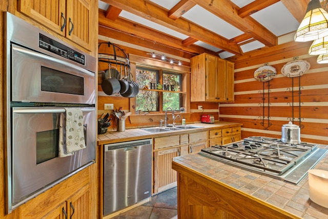 1836 Red Lick Rd, Berea, KY 40403 - kitchen with appliances with stainless steel finishes, tile counters, wood walls, and beam ceiling