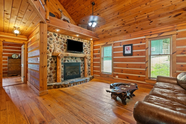 1836 Red Lick Rd, Berea, KY 40403 - living room featuring a fireplace, wood walls, wooden ceiling, hardwood / wood-style flooring, and lofted ceiling