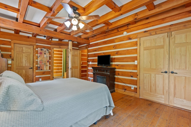 1836 Red Lick Rd, Berea, KY 40403 - bedroom with wood walls, hardwood / wood-style floors, and beamed ceiling