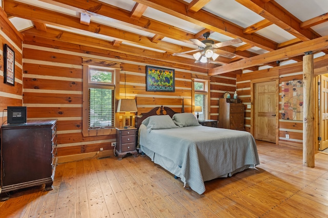 1836 Red Lick Rd, Berea, KY 40403 - bedroom with multiple windows, wood walls, beamed ceiling, and light wood-type flooring