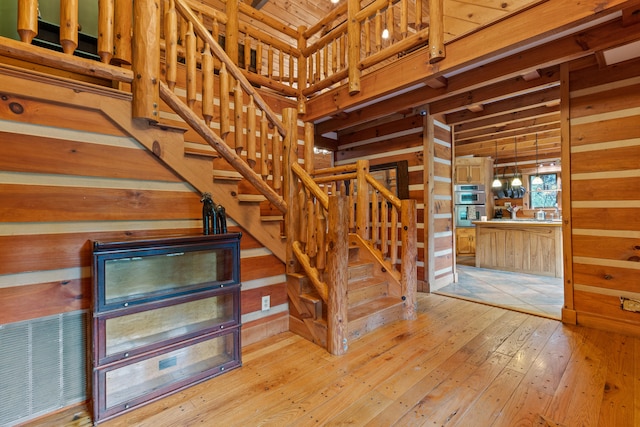 1836 Red Lick Rd, Berea, KY 40403 - stairs featuring wood-type flooring and wooden walls