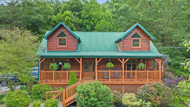 1836 Red Lick Rd, Berea, KY 40403 - rustic home with a metal roof, covered porch, and a forest view