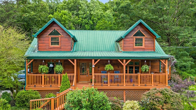 1836 Red Lick Rd, Berea, KY 40403 - rustic home featuring a porch, a metal roof, and a forest view