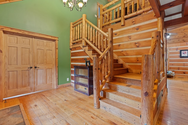 1836 Red Lick Rd, Berea, KY 40403 - stairs with wood-type flooring and a chandelier