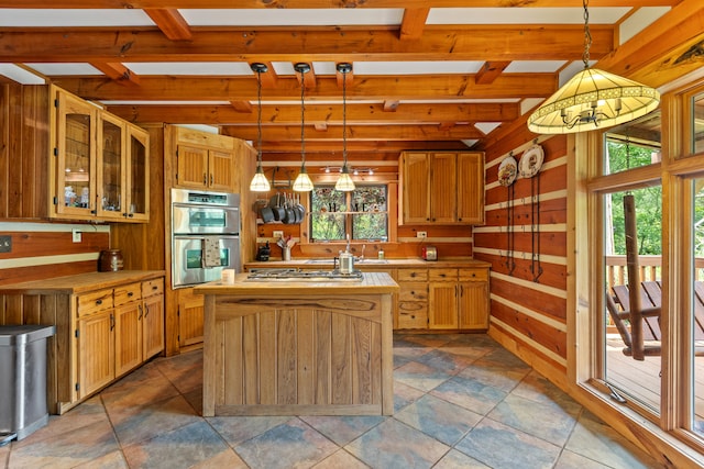 1836 Red Lick Rd, Berea, KY 40403 - kitchen featuring stainless steel appliances, light countertops, plenty of natural light, wooden walls, and beamed ceiling