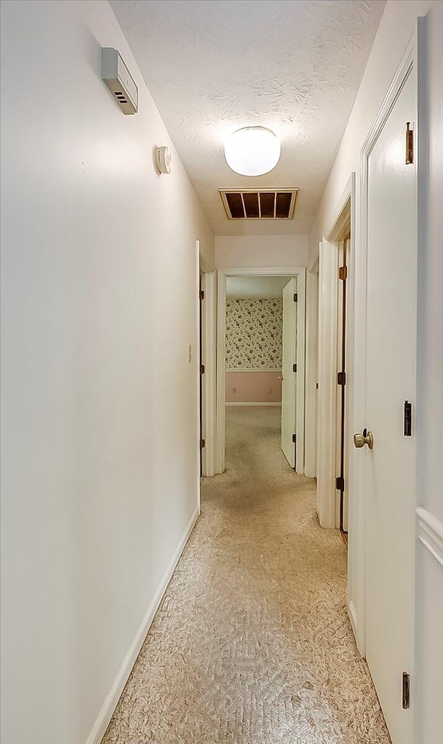 396 Squires Cir, Lexington, KY 40515 - hallway with a textured ceiling and light colored carpet