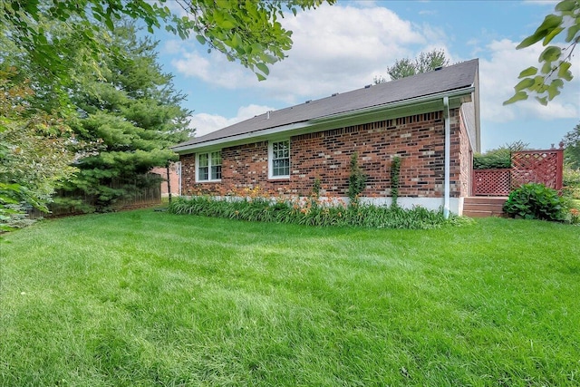 396 Squires Cir, Lexington, KY 40515 - view of side of home featuring a yard, brick siding, and a deck