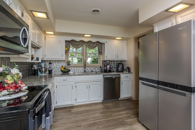 331 Clearbrook Dr, Danville, KY 40422 - kitchen featuring appliances with stainless steel finishes, white cabinets, decorative backsplash, wood finished floors, and light stone countertops