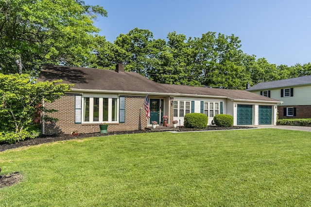331 Clearbrook Dr, Danville, KY 40422 - view of front of home featuring an attached garage, a chimney, a front lawn, driveway, and brick siding