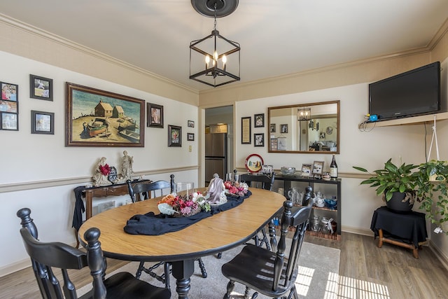 331 Clearbrook Dr, Danville, KY 40422 - dining area featuring light wood-style floors, a chandelier, and crown molding