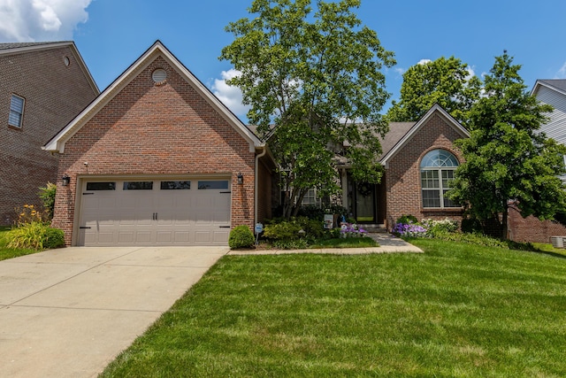 4368 River Oak Trl, Lexington, KY 40515 - traditional home with brick siding, a front yard, a garage, and driveway