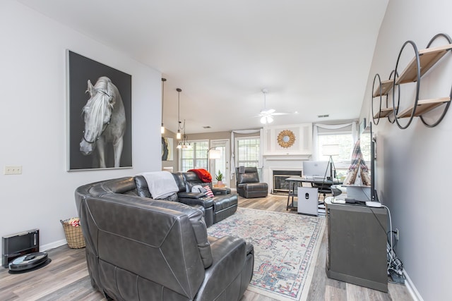 4368 River Oak Trl, Lexington, KY 40515 - living room featuring a ceiling fan, a fireplace, and light wood-type flooring
