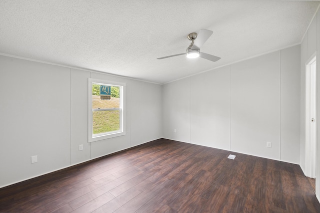 174 Sky Ln, Cynthiana, KY 41031 - empty room with dark wood finished floors, ceiling fan, a textured ceiling, ornamental molding, and a decorative wall