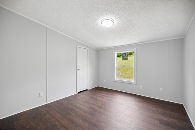 174 Sky Ln, Cynthiana, KY 41031 - spare room featuring a textured ceiling, dark wood-type flooring, and crown molding