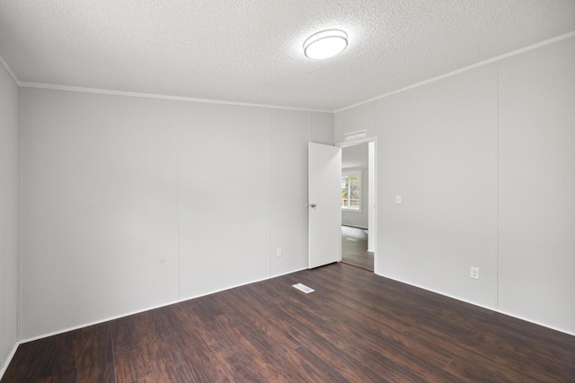 174 Sky Ln, Cynthiana, KY 41031 - spare room featuring a textured ceiling, ornamental molding, and wood finished floors