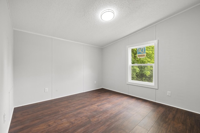 174 Sky Ln, Cynthiana, KY 41031 - empty room with a textured ceiling, ornamental molding, dark wood-style floors, and lofted ceiling