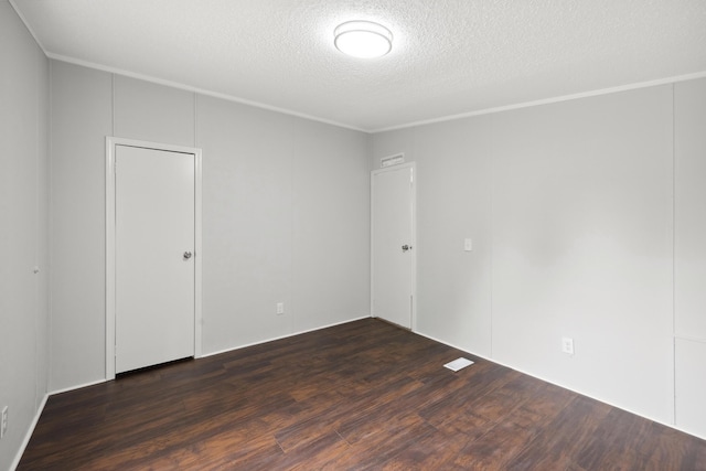 174 Sky Ln, Cynthiana, KY 41031 - empty room featuring a textured ceiling, dark wood-type flooring, and crown molding