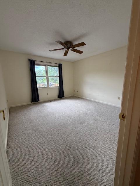 529 S 2nd St, Williamsburg, KY 40769 - unfurnished room with a ceiling fan, carpet floors, and a textured ceiling