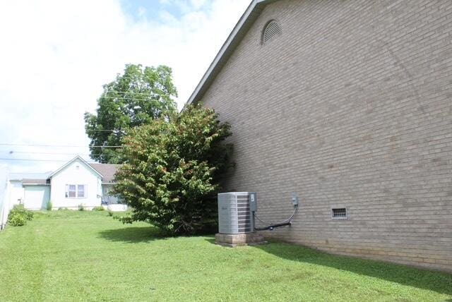 529 S 2nd St, Williamsburg, KY 40769 - view of side of home with brick siding and a lawn