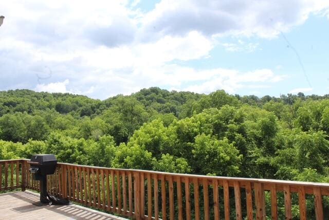529 S 2nd St, Williamsburg, KY 40769 - wooden deck with a grill and a wooded view