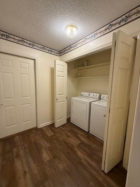 529 S 2nd St, Williamsburg, KY 40769 - laundry room featuring a textured ceiling, dark wood-type flooring, and washing machine and dryer