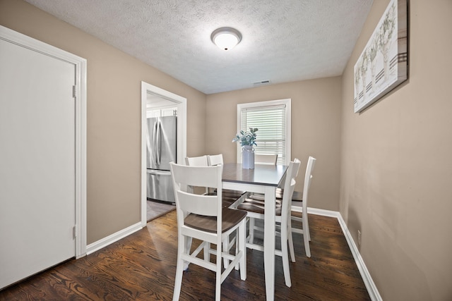 9209 W Hwy 80, Nancy, KY 42544 - dining space with a textured ceiling and wood finished floors