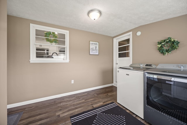 9209 W Hwy 80, Nancy, KY 42544 - laundry room featuring washer and clothes dryer, dark wood-style flooring, and a textured ceiling