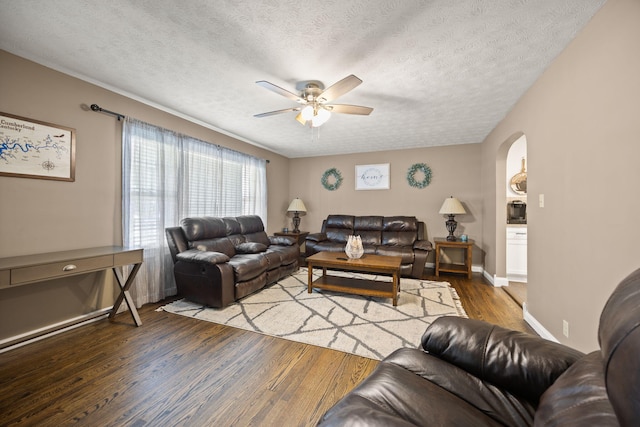 9209 W Hwy 80, Nancy, KY 42544 - living area featuring ceiling fan, arched walkways, wood finished floors, and a textured ceiling