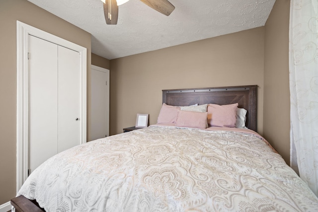 9209 W Hwy 80, Nancy, KY 42544 - bedroom featuring a closet, a textured ceiling, and a ceiling fan