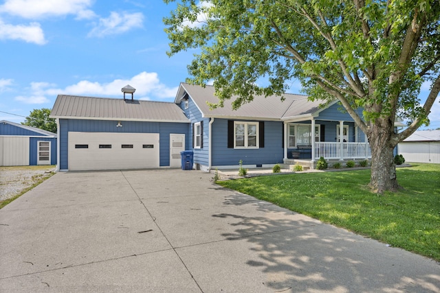9209 W Hwy 80, Nancy, KY 42544 - single story home featuring covered porch, a front lawn, driveway, a garage, and a metal roof