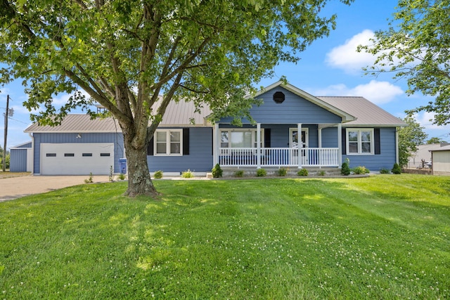9209 W Hwy 80, Nancy, KY 42544 - ranch-style house featuring a porch, concrete driveway, a front lawn, an attached garage, and a metal roof