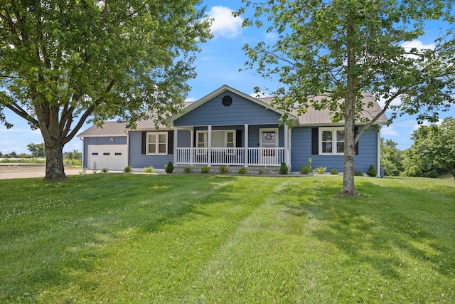 9209 W Hwy 80, Nancy, KY 42544 - ranch-style home with covered porch, a garage, a front lawn, and board and batten siding