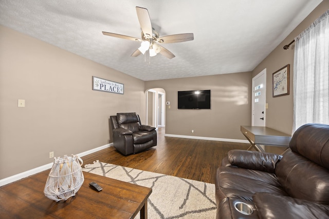 9209 W Hwy 80, Nancy, KY 42544 - living room with arched walkways, wood finished floors, a ceiling fan, and a textured ceiling