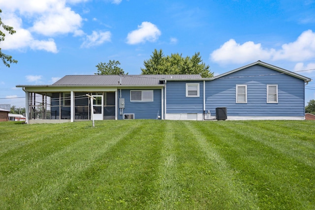 9209 W Hwy 80, Nancy, KY 42544 - rear view of property with a sunroom, a lawn, and a metal roof