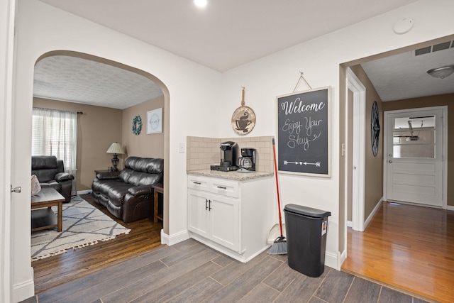 9209 W Hwy 80, Nancy, KY 42544 - hall with arched walkways, dark wood-style flooring, and plenty of natural light